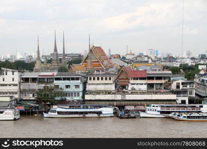 Temples and buildings on the bank of river Chao Phraya in Bangkok, Thailand