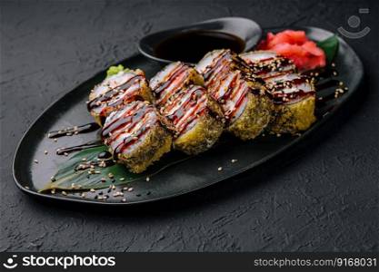 tempura fried rolls on black background