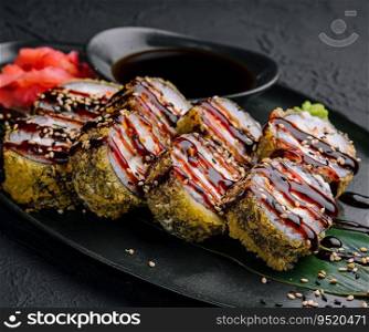 tempura fried rolls on black background