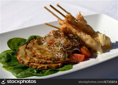 Tempura Prawns, served with Asian Glass Noodles, Caramelised Pineapple, and Citris Aioli