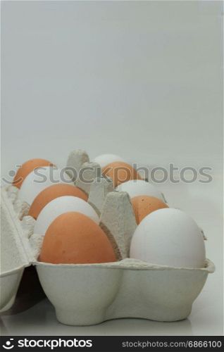 Ten fresh eggs in a carton box
