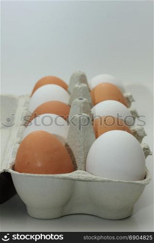 Ten fresh eggs in a carton box