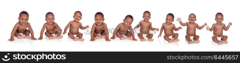 Ten funny african babies sitting on the floor isolated on white background
