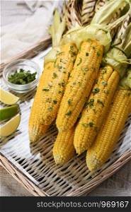 Tender, juicy grilled corn on the cob, seasoned butter with spicy curry and cilantro, grilled