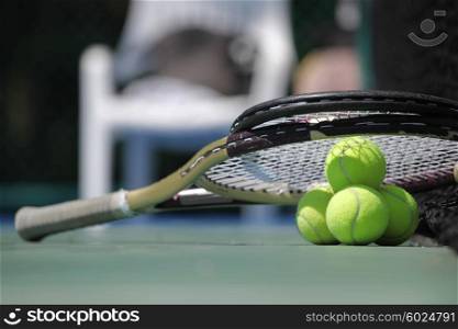 Tennis ball and racket. Tennis ball and racket on court close up