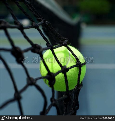 tennis ball in the net