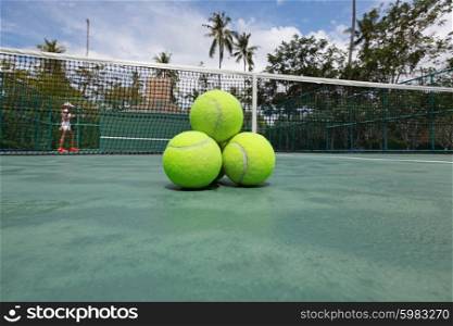 Tennis balls on court. Tennis balls on the court close-up