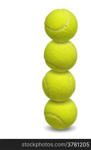 tennis balls stacked together over white