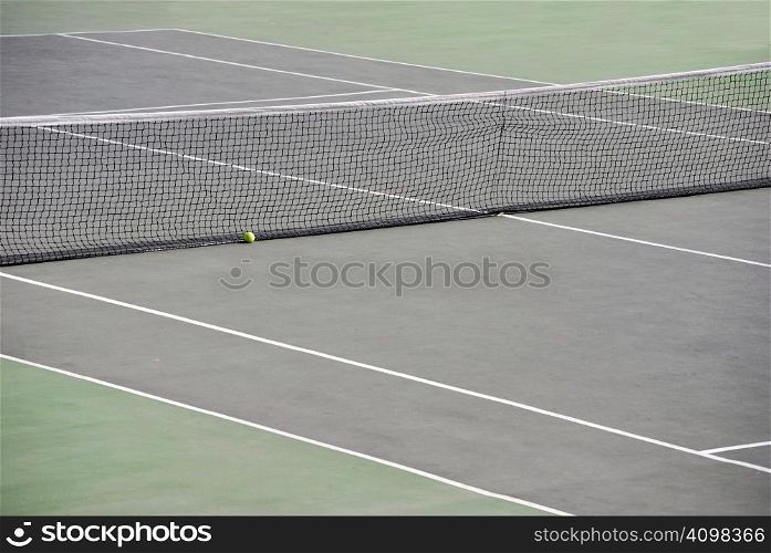 Tennis net with a ball in the playground