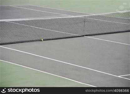 Tennis net with a ball in the playground