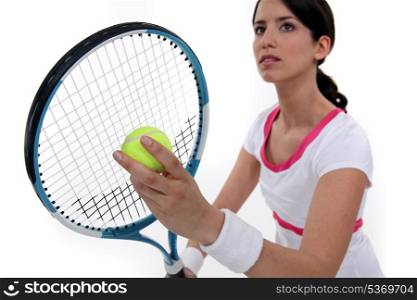 Tennis player about to serve