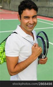 Tennis Player Carrying Equipment