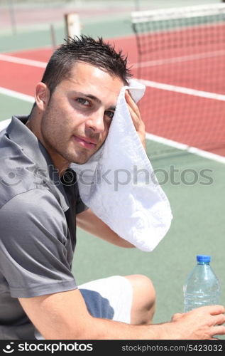 Tennis player drying head