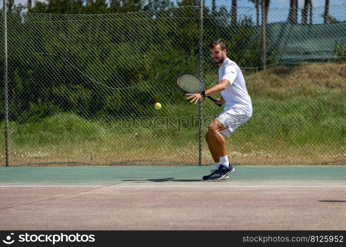 Tennis player hitting forehand at ball with racket on court.