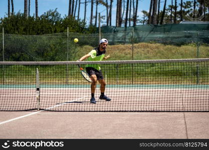 Tennis player performing a drop shot on court.