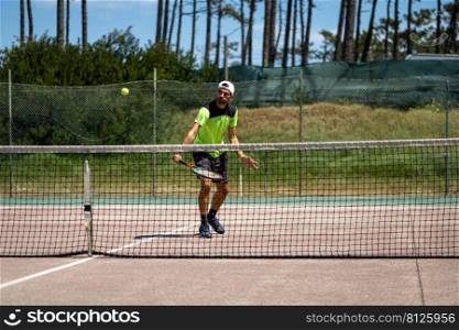 Tennis player performing a drop shot on court.