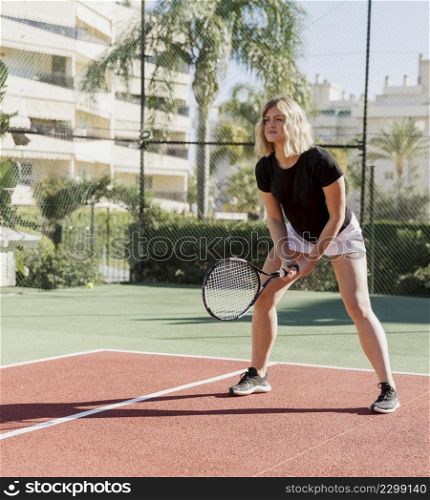 tennis player preparing hit ball