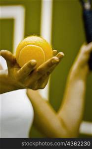 Tennis player preparing to serve the ball