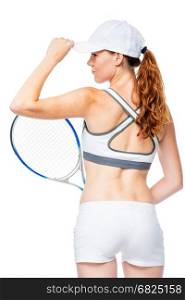 Tennis player with racket stands with back in frame isolated