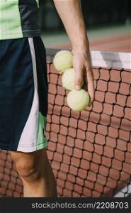 tennis player with three balls