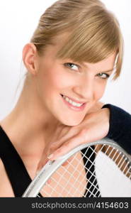 Tennis player woman young smiling leaning on racket isolated