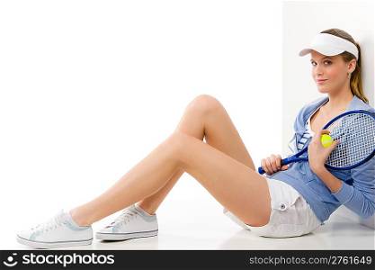 Tennis player - young woman holding racket in fitness outfit