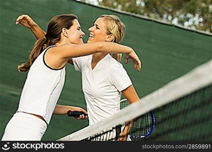 Tennis Players Hugging Each Other After Match
