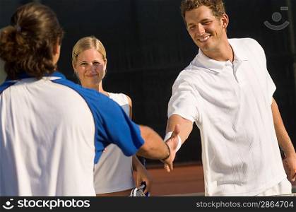 Tennis Players Shaking Hands at Net