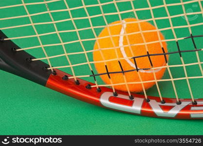 tennis racket and ball on a green background