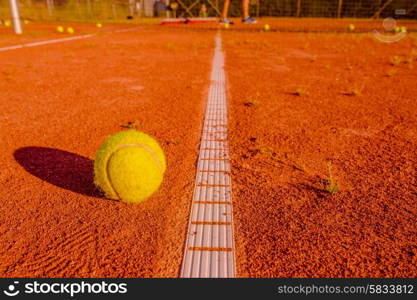 Tennis training session with a ball at the line