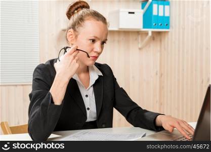 tense female accountant working in the laptop in the office