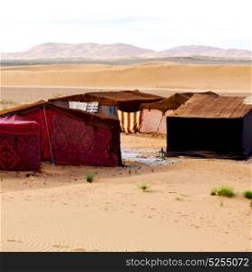 tent in the desert of morocco sahara and rock stone sky