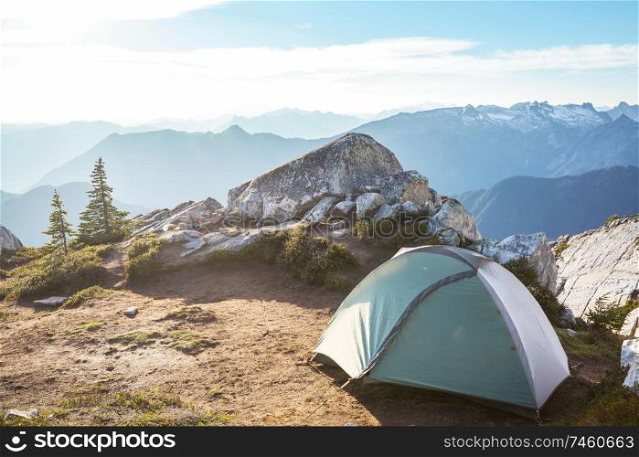tent in the summer mountains. Hiking concept.