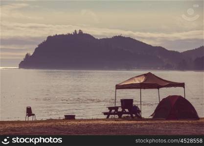 tent in waterfront camping in the Alaska. Summer season. Inspiring recreation.