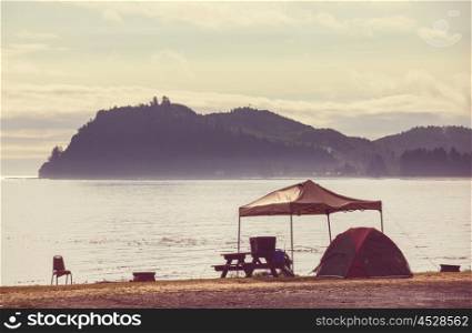 tent in waterfront camping in the Alaska. Summer season. Inspiring recreation.