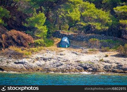 Tent in wilderness by the sea, camping in nature