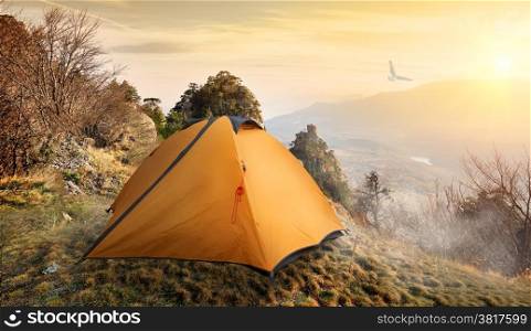 Tent on the top of mountains in autumn