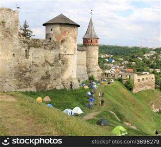 Tents under ancient castle walls