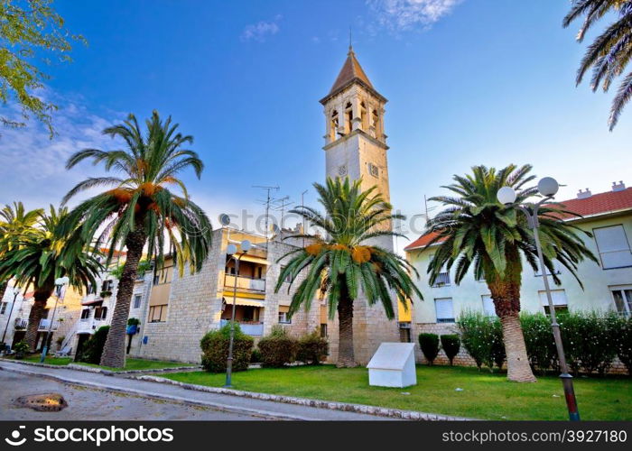 Teogir stone church and palms view, UNESCO site in Croatia
