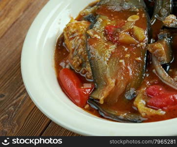 Tepsi Baytinijan- popular Iraqi casserole .dish is aubergine,baking dish, accompanied with meatballs, tomatoes, onions and garlic.