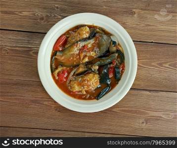 Tepsi Baytinijan- popular Iraqi casserole .dish is aubergine,baking dish, accompanied with meatballs, tomatoes, onions and garlic.