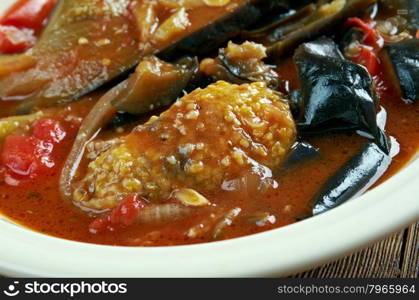 Tepsi Baytinijan- popular Iraqi casserole .dish is aubergine,baking dish, accompanied with meatballs, tomatoes, onions and garlic.