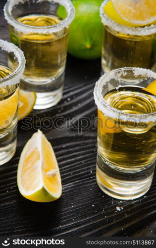 Tequila drink served in glasses with lime and salt