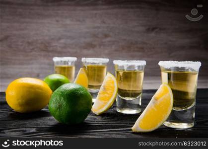 Tequila drink served in glasses with lime and salt