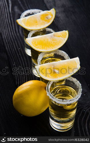 Tequila drink served in glasses with lime and salt. The tequila drink served in glasses with lime and salt