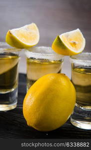 Tequila drink served in glasses with lime and salt