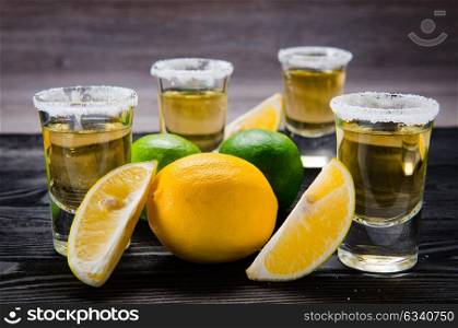 Tequila drink served in glasses with lime and salt. The tequila drink served in glasses with lime and salt