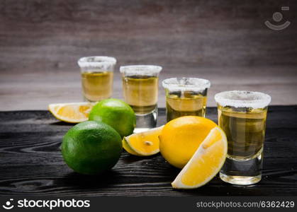 Tequila drink served in glasses with lime and salt