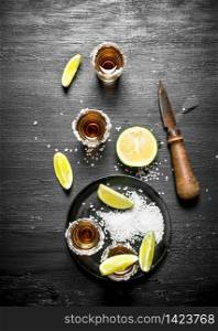 Tequila with salt and lime. On the chalkboard.. Tequila with salt and lime.