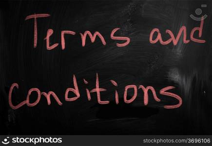 ""Terms &amp; Conditions" handwritten with white chalk on a blackboard"